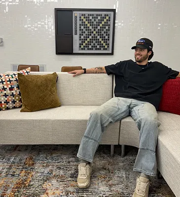 young man lounging on a couch